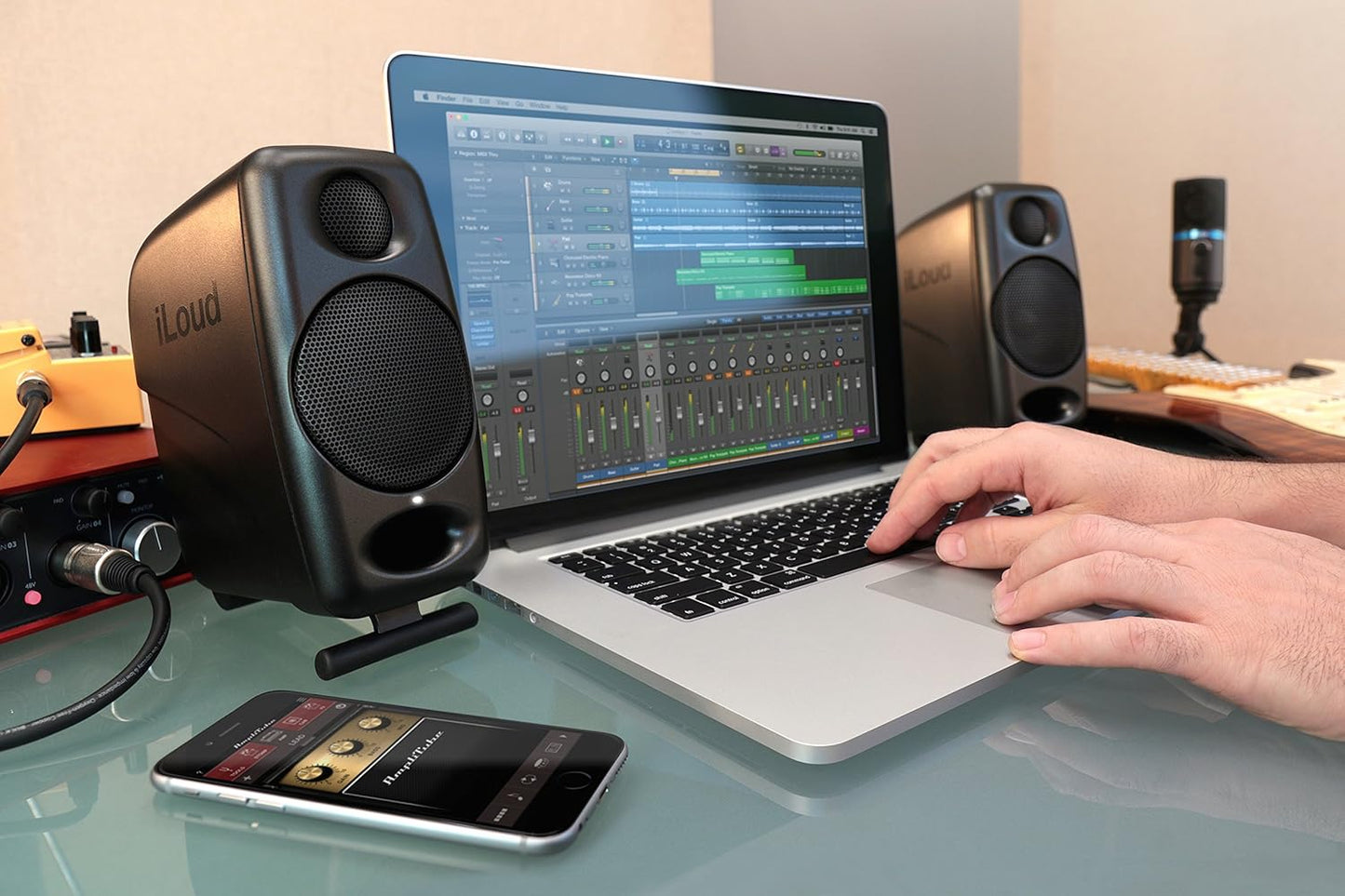 iLoud Micro Bluetooth monitor speakers for music production with a laptop and smartphone